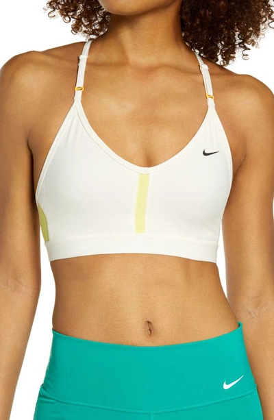 Shop Nike Indy Mesh Inset Sports Bra In Pale Ivory/ Citron/ Black