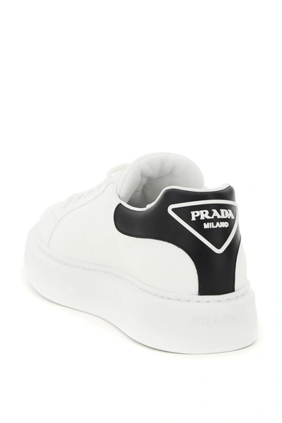 Shop Prada Macro Leather Sneakers In White,black