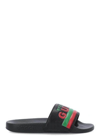 Shop Gucci Kids Logo Embossed Slides In Black