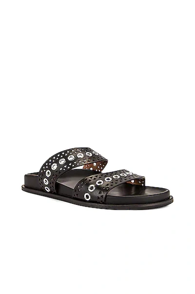 Shop Alaïa Perforated Eyelet Slides In Noir