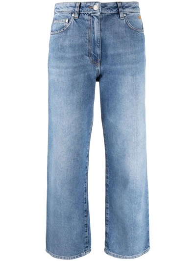 Shop Msgm Cropped Embroidered-logo Jeans In Blue