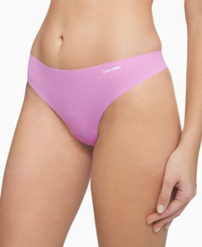 Shop Calvin Klein Women's Invisibles Thong Underwear D3428 In Lilac Rain