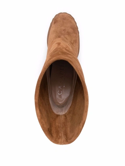 Shop Casadei Boots Beige