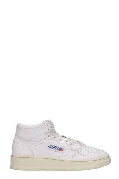 Shop Autry Mid Sneakers In White Leather