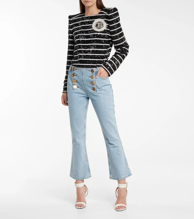 Shop Balmain Embellished Low-rise Flared Jeans In Blue