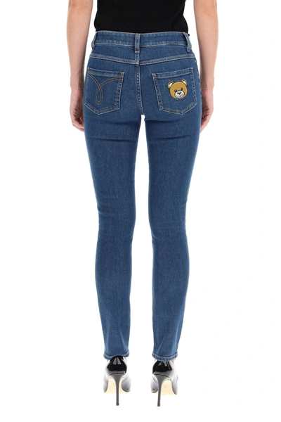 Shop Moschino Denim Teddy Bear Skinny  Jeans In Blue