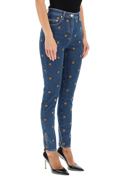 Shop Moschino All-over Teddy Bear Embroidered Denim Jeans In Blue
