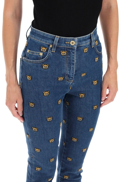 Shop Moschino All-over Teddy Bear Embroidered Denim Jeans In Blue
