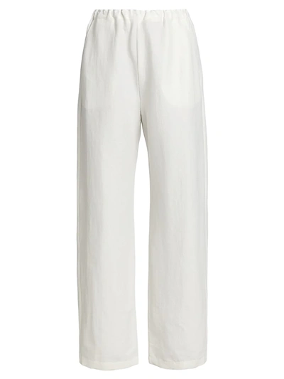 Shop Totême Stretch Linen Pants In City White