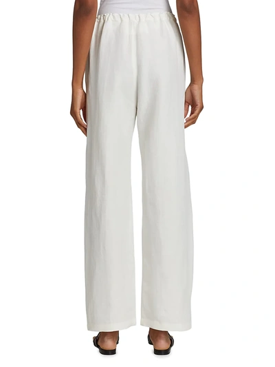 Shop Totême Stretch Linen Pants In City White