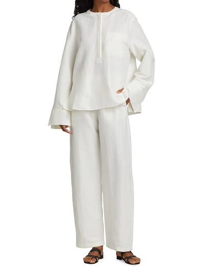 Shop Totême Stretch Linen Pants In City White