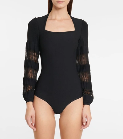 Shop Alaïa Stretch-knit Bodysuit In Black