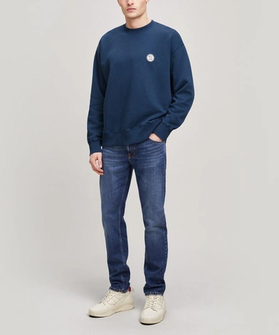 Shop Nudie Jeans Lukas Round Logo Sweater In Indigo Blue