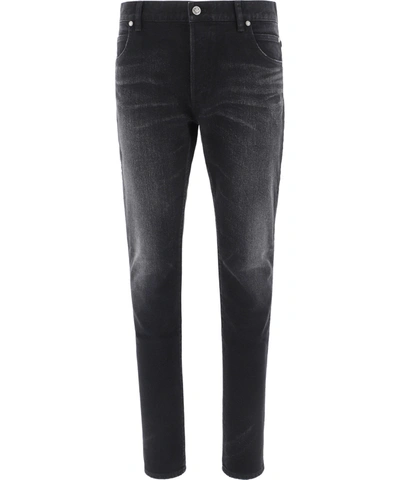 Shop Balmain "embossed B" Jeans In Black  