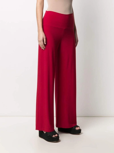 Shop Norma Kamali Trousers Red