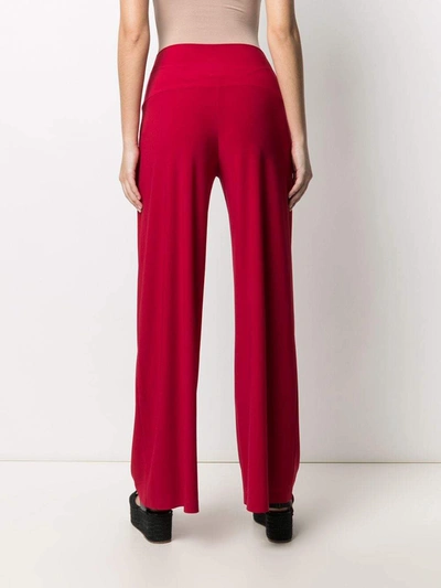 Shop Norma Kamali Trousers Red