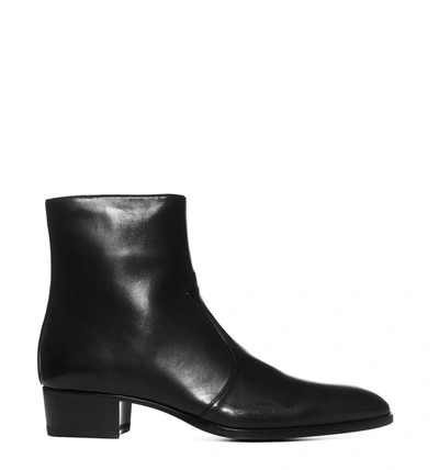Shop Saint Laurent Wyatt Zipped Ankle Boots In Black