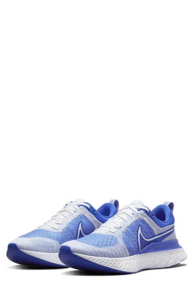 Shop Nike React Infinity Run Flyknit 2 Running Shoe In White/ Hyper Royal