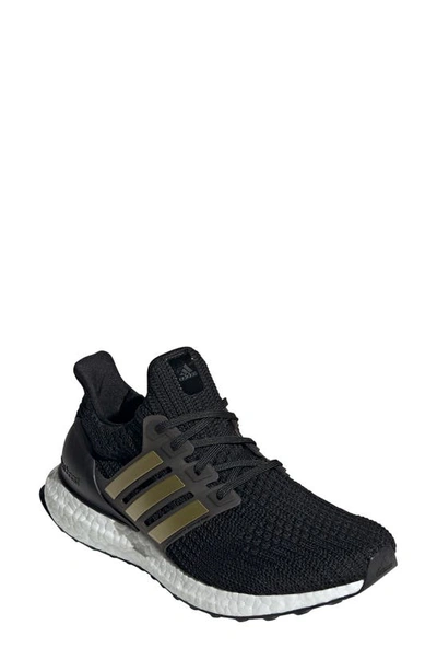 Shop Adidas Originals Ultraboost Dna Running Shoe In Core Black/ Gold / White