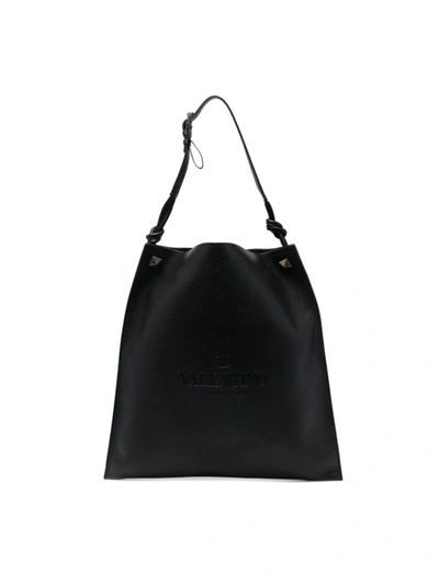 Shop Valentino Logo Debossed Tote Bag In Black