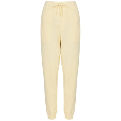 Shop Nanushka Shay Cream Cotton Sweatpants