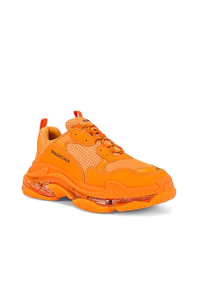 Shop Balenciaga Triple S Clear Sole In Orange & Black