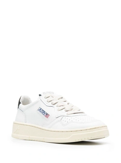 Shop Autry White Leather Sneakers With Black Heel Tab In White/black