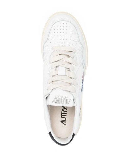Shop Autry White Leather Sneakers With Black Heel Tab In White/black