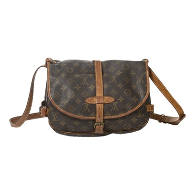 Pre-owned Louis Vuitton Saumur Cloth Handbag In Brown