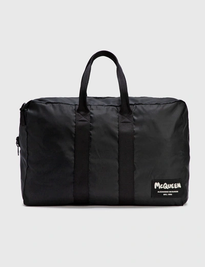 Shop Alexander Mcqueen Zipped Duffle Bag In Black