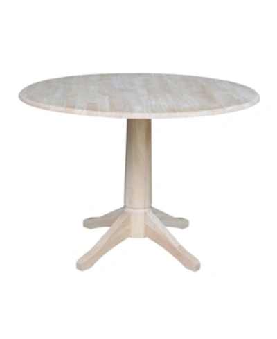 International Concepts 42" Round Dual Drop Leaf Pedestal Table In Cream