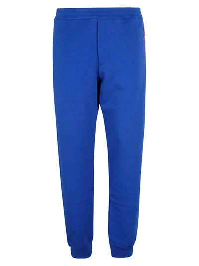 Shop Alexander Mcqueen Logo Patched Track Pants In Bold Blue/mix
