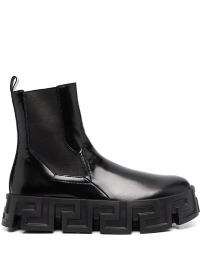 Shop Versace Ridged-sole Ankle Boots In Schwarz