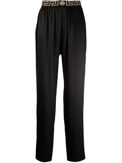 Shop Versace Greca Waistband Pyjama Trousers In Black