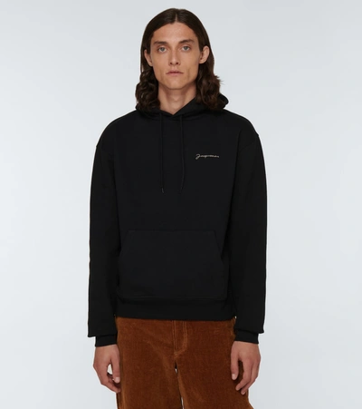 Shop Jacquemus Le Sweatshirt Brodé Hooded Sweatshirt In Black