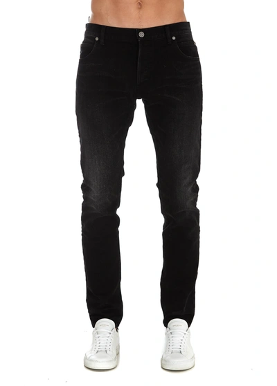 Shop Balmain Embossed Logo Jeans In Black