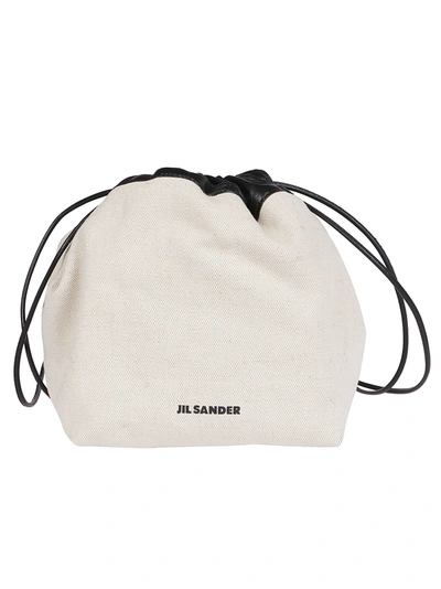 Shop Jil Sander Logo Printed Drawstring Bucket Bag In Beige