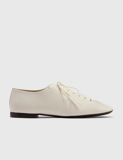 Shop Lemaire Flat Derby In White