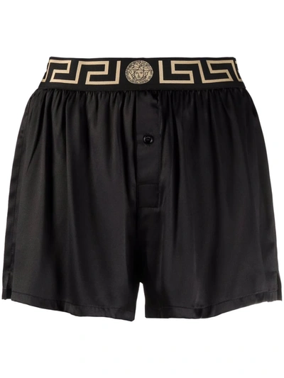 Shop Versace Greca Waistband Shorts In Black