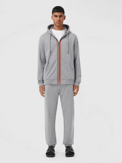 Shop Burberry Icon Stripe Detail Cotton Hooded Top In Pale Grey Melange