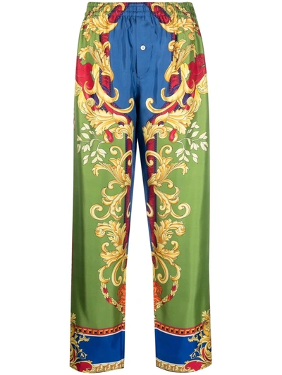 Shop Versace Baroque-pattern Print Trousers In Green