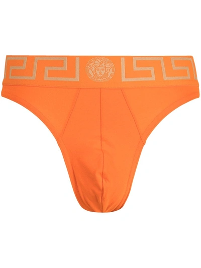 Shop Versace Greca Border Thong In Orange