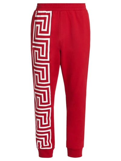 Shop Versace Greca Print Sweatpants In Red
