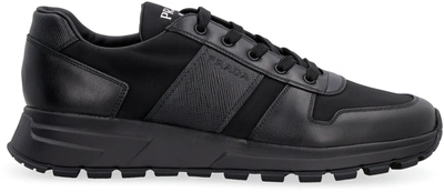 Shop Prada Panelled Low Top Sneakers In Black