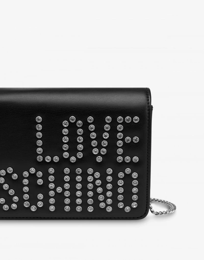 Shop Love Moschino Crystal Logo Clutch In Black