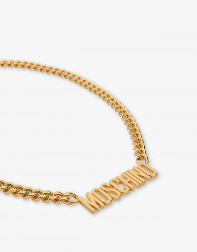 Shop Moschino Lettering Logo Necklace In Gold