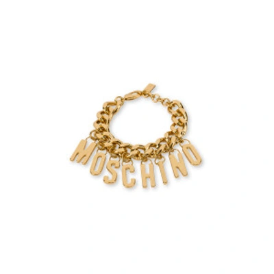 Shop Moschino Lettering Charm Bracelet In Gold