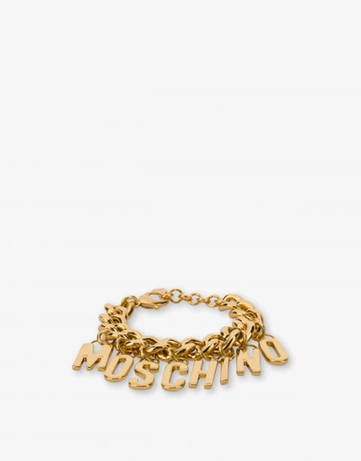 Shop Moschino Lettering Charm Bracelet In Gold