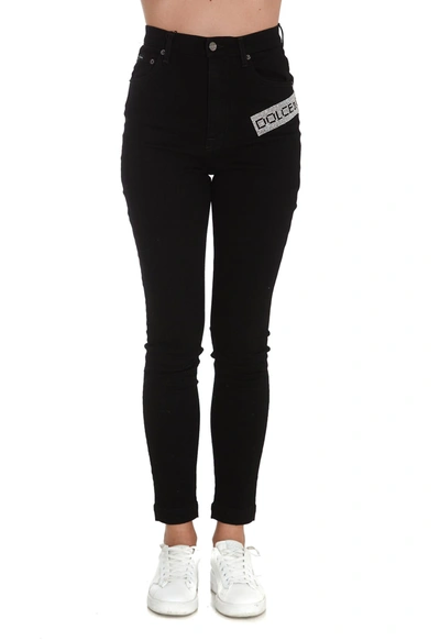 Shop Dolce & Gabbana Crystal Logo Embellished Jeans In Black