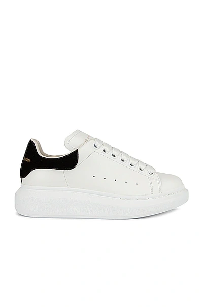 Shop Alexander Mcqueen Lace Up Sneakers In White & Black